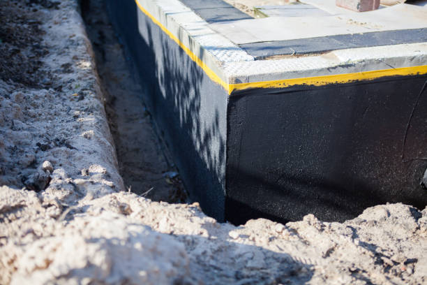 Professional Waterproofing technician working in Shelby, MI